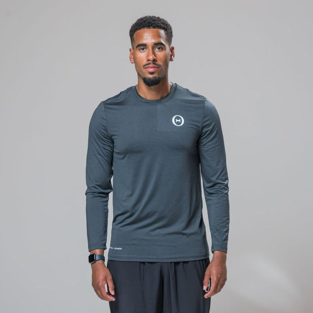 Front view of our THETA element long sleeve t-shirt. This top was made for athleisure wear and functional fitness. Paired with our white logo core trackies. 