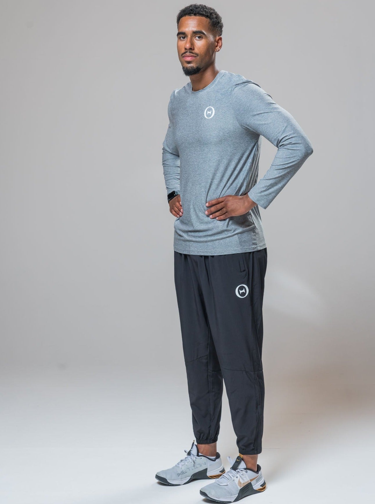 Complete look of our THETA element long sleeve t-shirt and white logo THETA core trackies. Finished with white nike metcon 8's. 