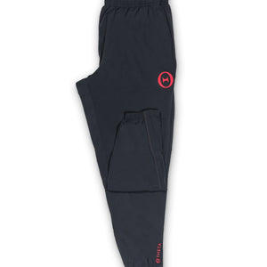 Flat view of our THETA core gym wear trackies. Featuring our left leg red THETA logo and our subtle back right leg THETA logo and wording.